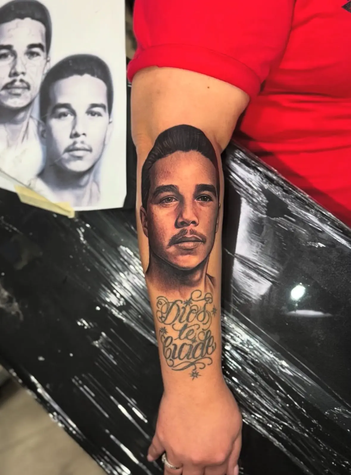 Realistic portrait forearm tattoo